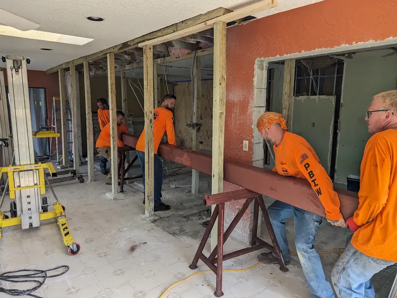 Crew installing a structural beam
