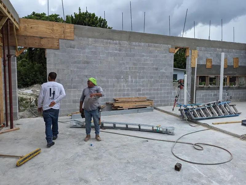 Masonry crew on a concrete block wall