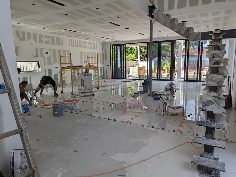 Tile setter at work