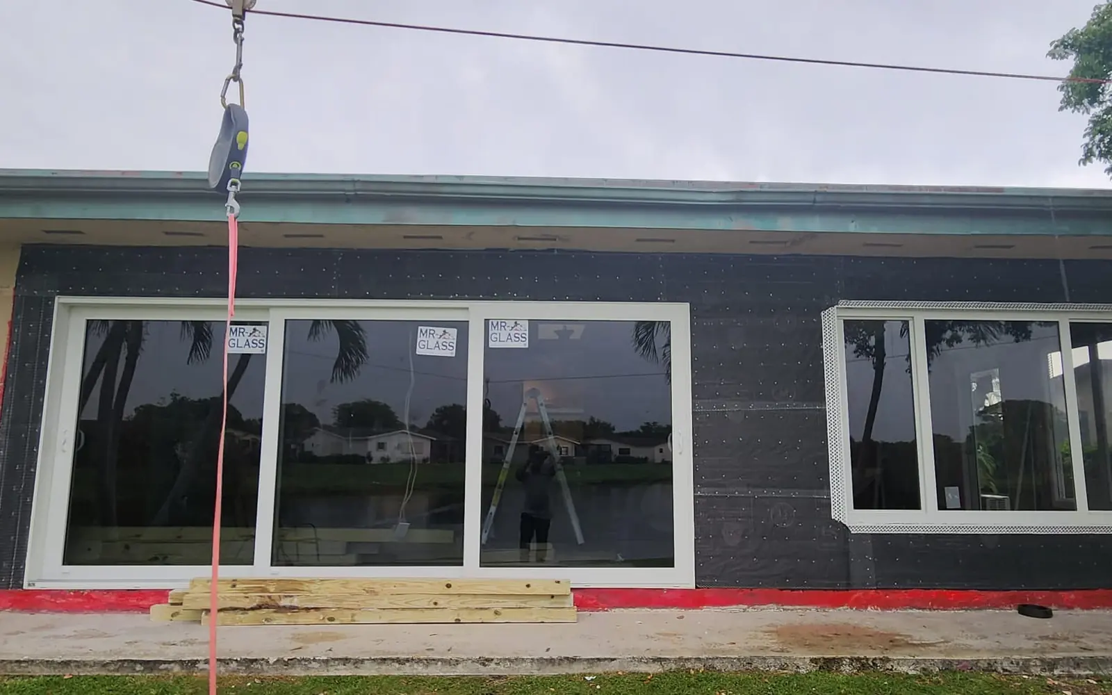Crew installing impact sliding glass doors