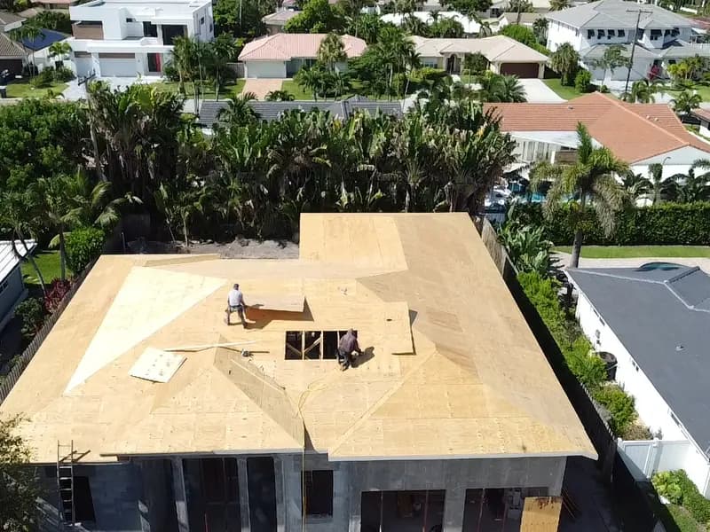 New roof deck sheathed, aerial view