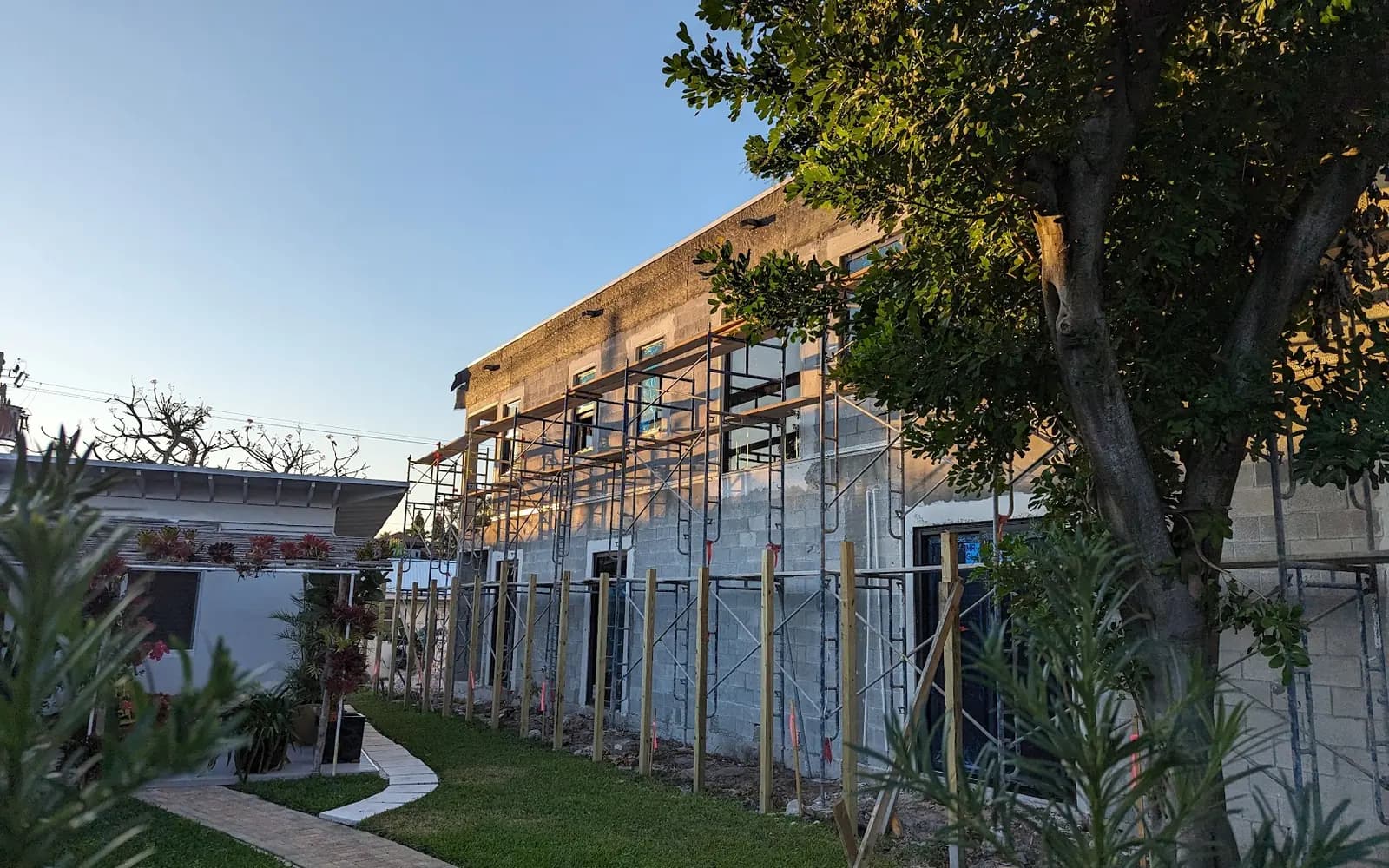 New backyard fence and paver walkway