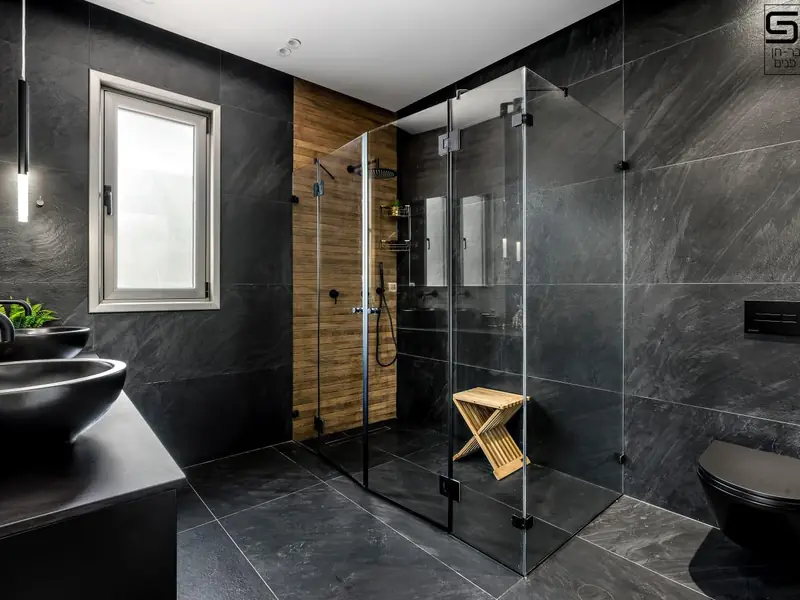 Dark large-format tile bathroom