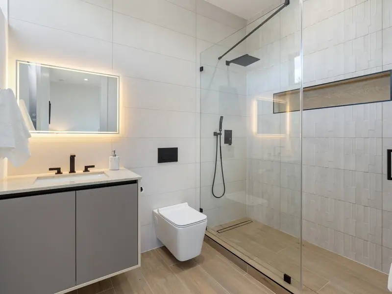 Bathroom with frameless glass shower