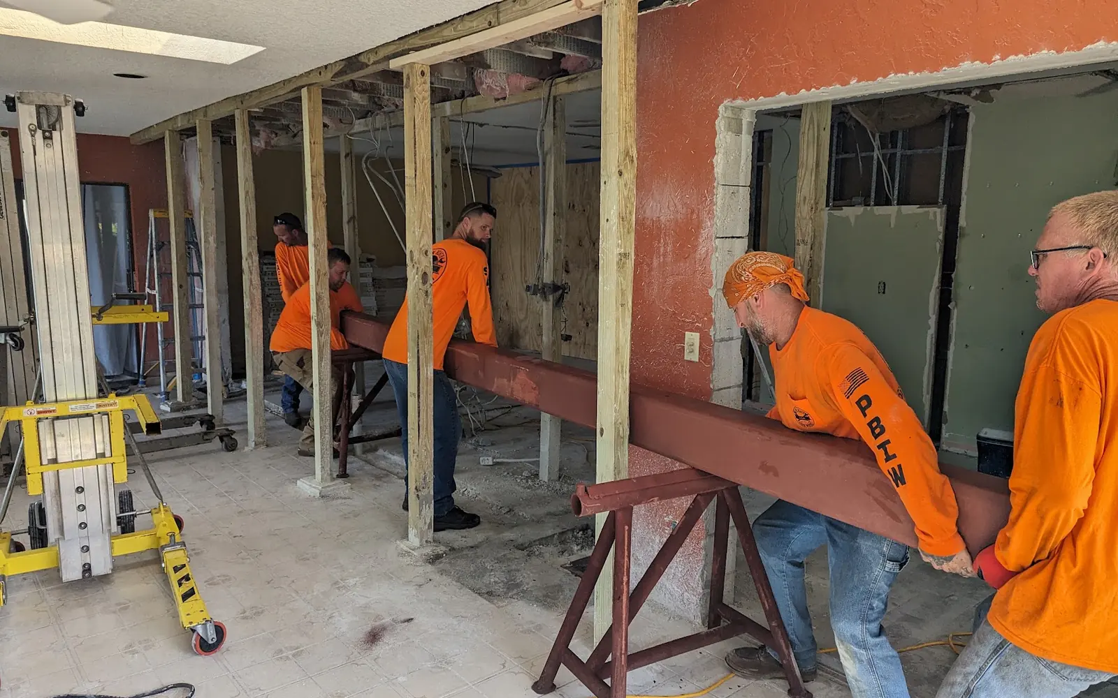 Crew installing a header beam