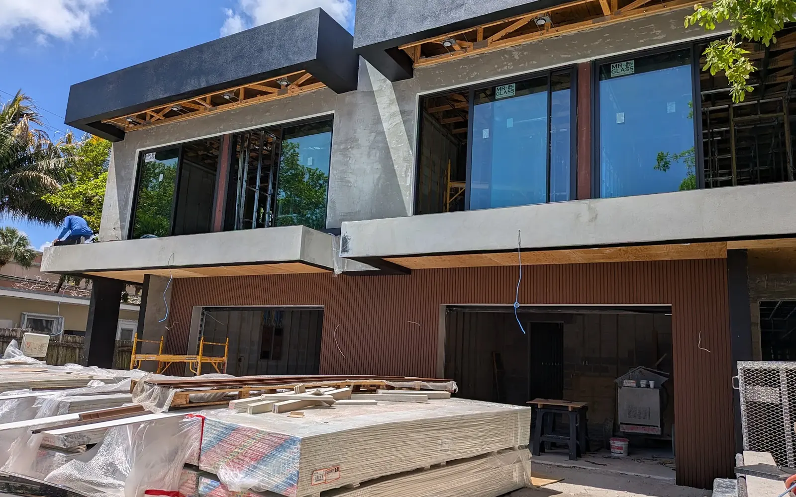 Modern home with garage during construction