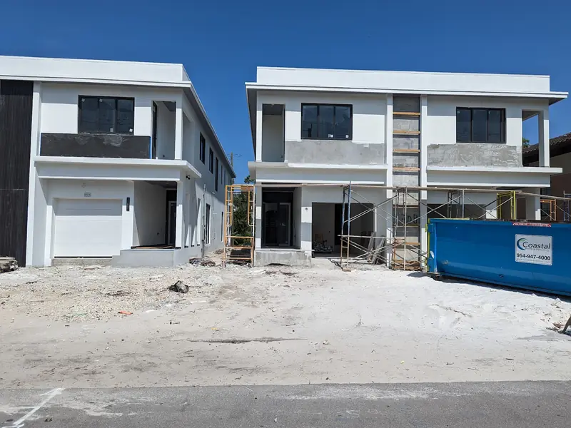 Two-story shell with garage opening
